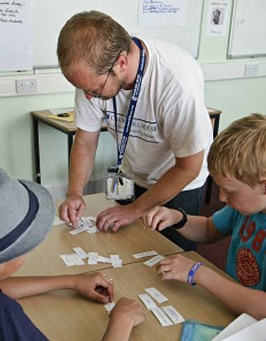 A teacher at a students table